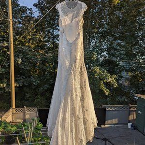 Two brand new wedding dresses